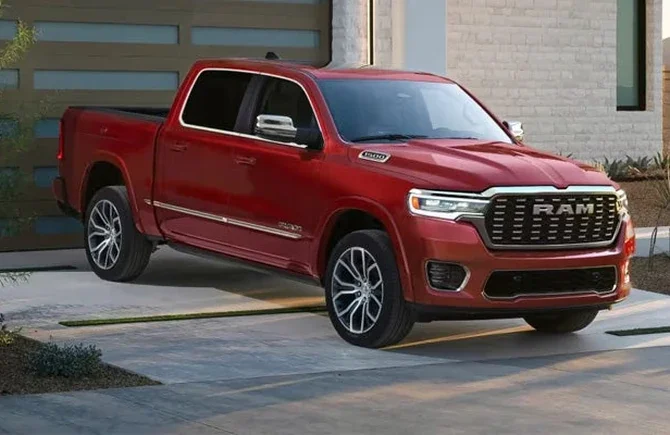 Red 2026 Ram 1500 parked on a residential driveway