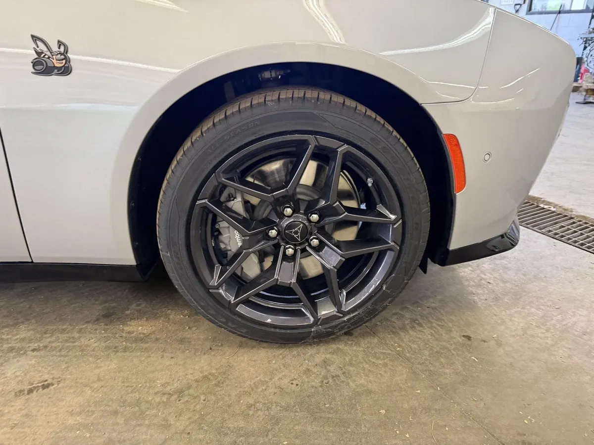 A front wheel and arch of the Charger in close-up.