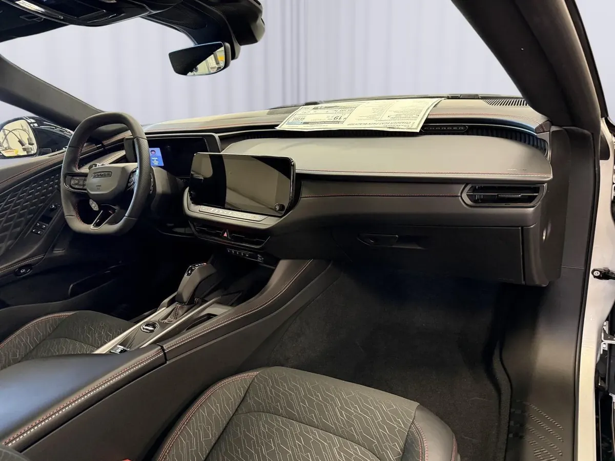 The dashboard and center screen seen from the passenger side.