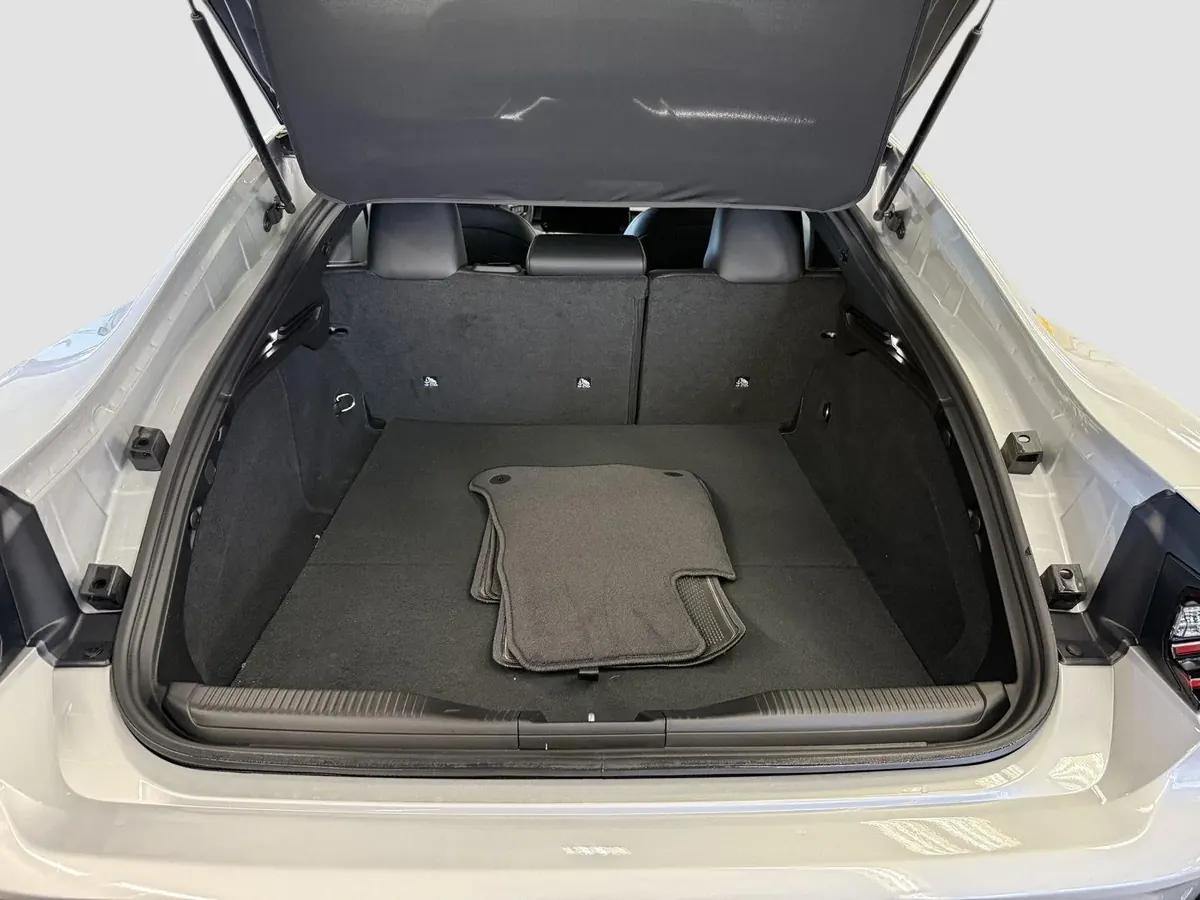 The load area behind the rear seats with the tailgate open.