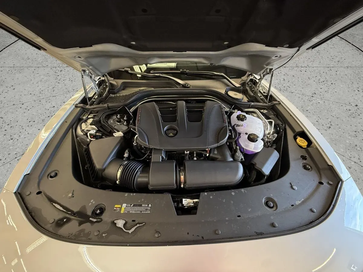 The engine bay with the hood raised.