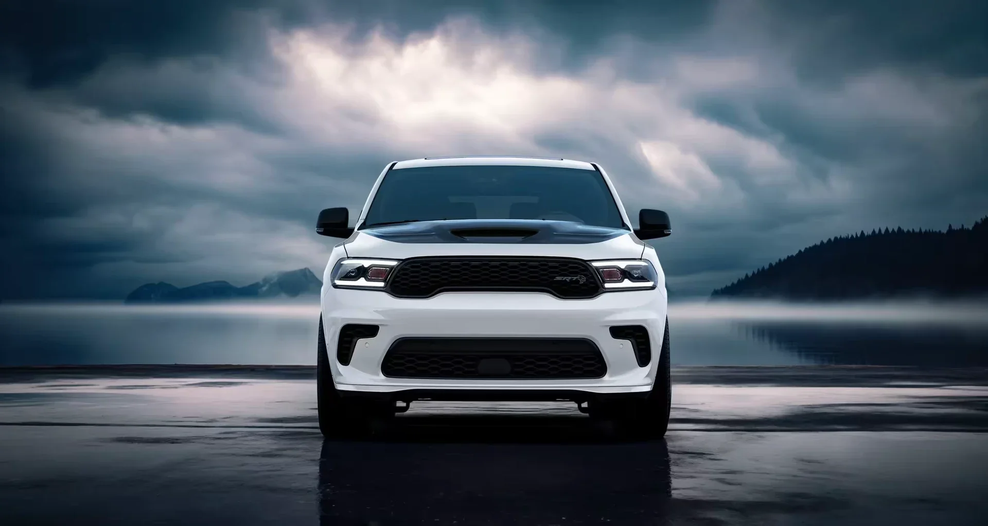A white 2026 Dodge Durango parked under a stormy sky.