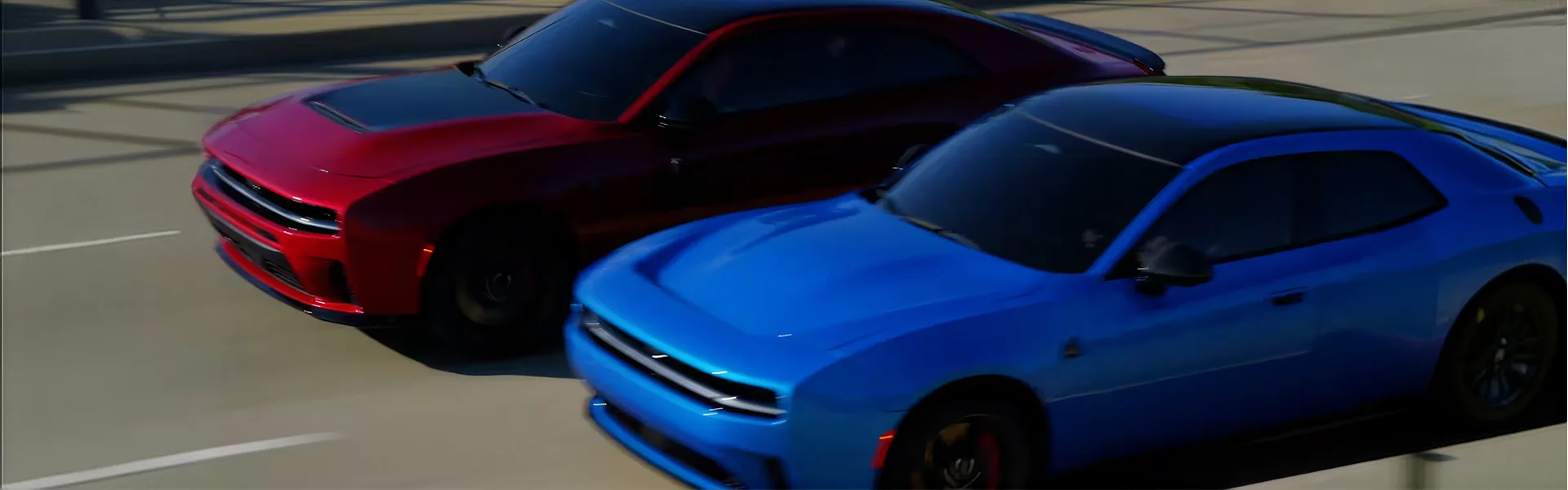 Red and blue 2026 Dodge Charger models driving side by side on a highway