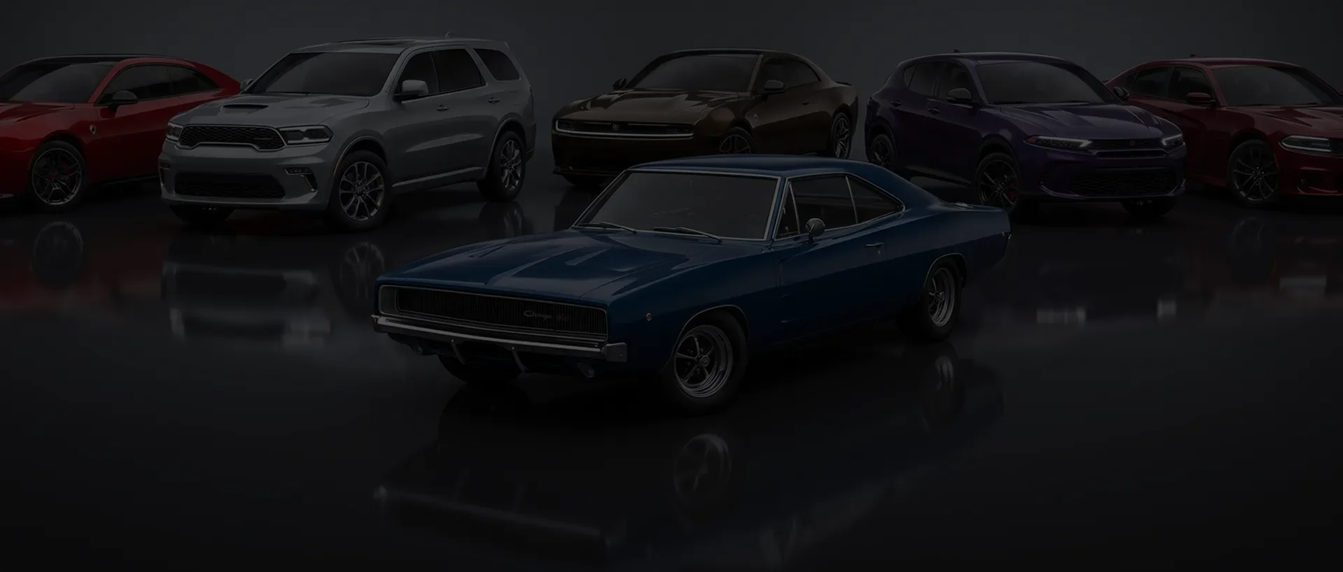 Line-up of Dodge vehicles on a dark reflective showroom floor