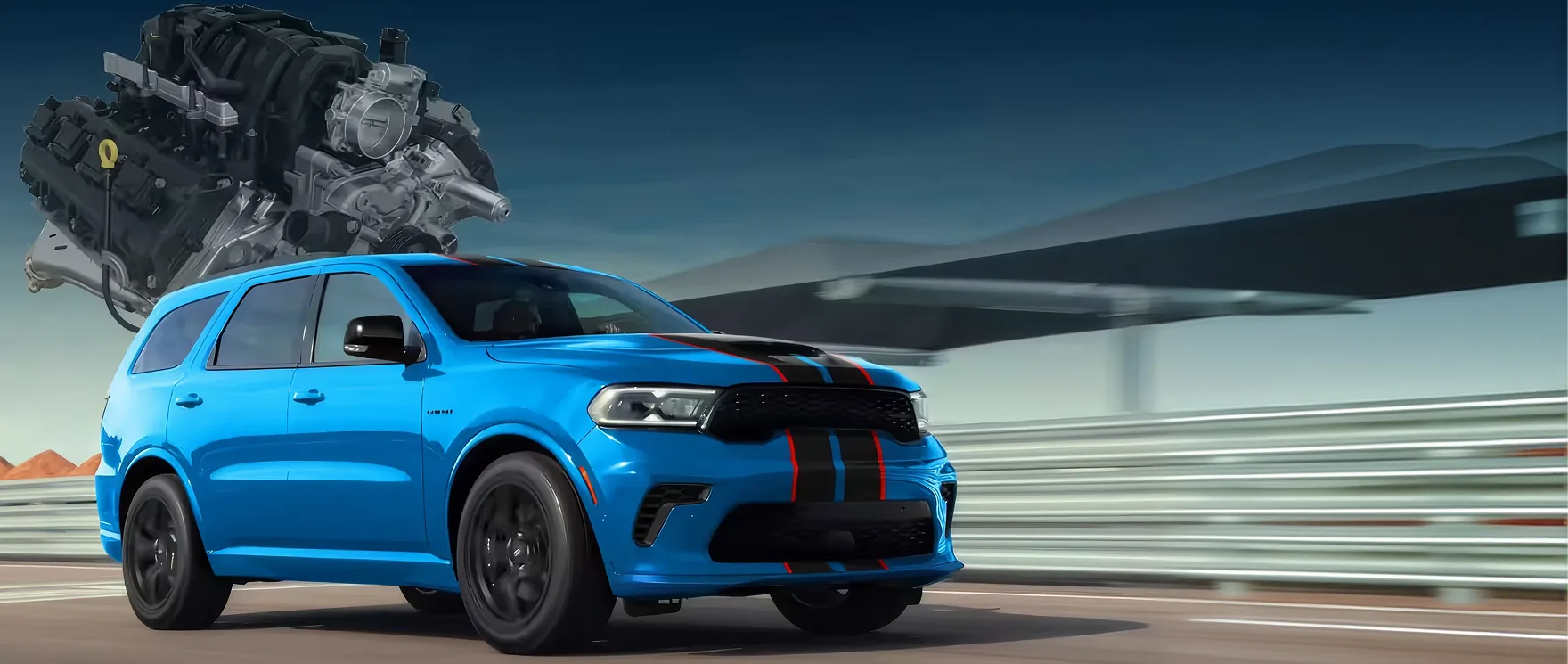 Blue Dodge Durango with racing stripes driving past a glass building