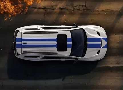 Overhead view of a white Dodge Durango with blue racing stripes