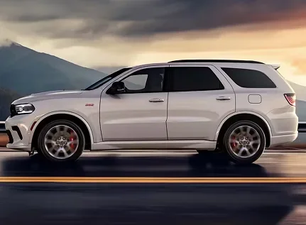White Dodge Durango in profile at sunset