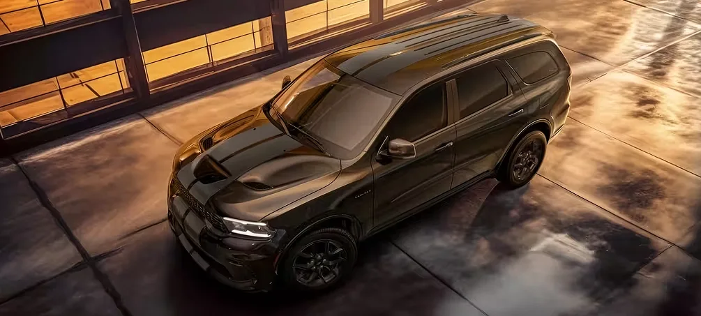 Overhead view of a bronze Dodge Durango with dual racing stripes