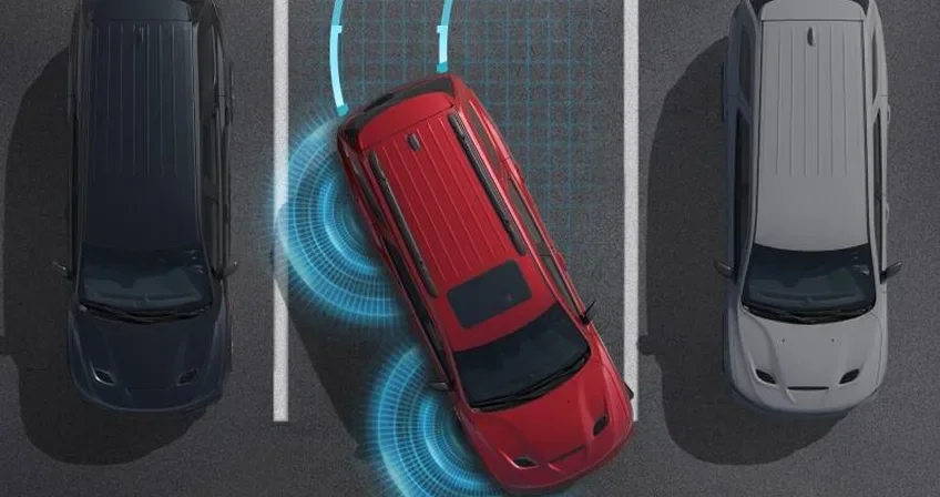 Overhead illustration of a red Durango reversing between parked cars with sensor waves