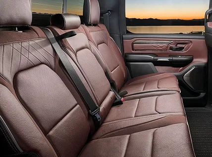 Rear bench seat of the RAM 1500 in burgundy quilted leather