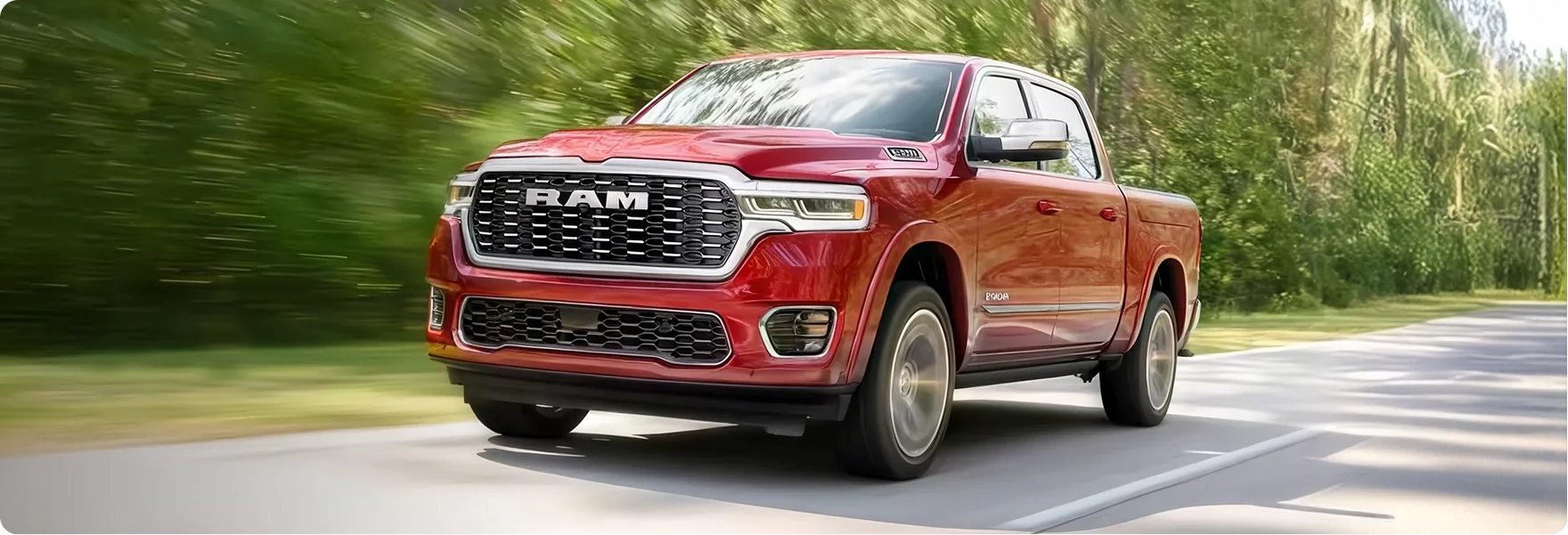 Red RAM 1500 driving along a tree-lined road with motion blur