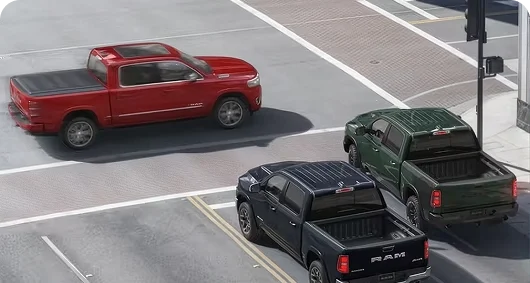 Overhead view of pickups approaching a road intersection