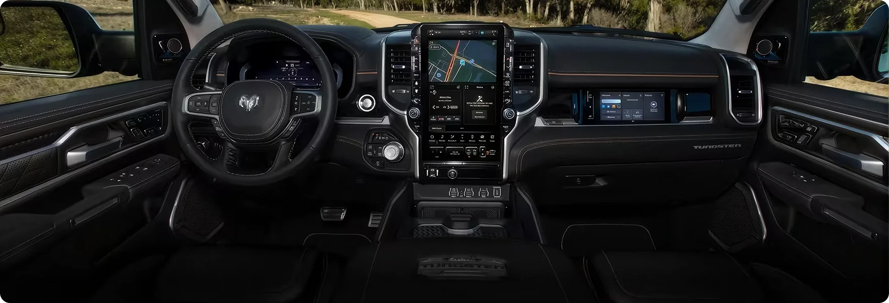 Wide view of the RAM 1500 Tungsten dashboard with the vertical touchscreen and front passenger display
