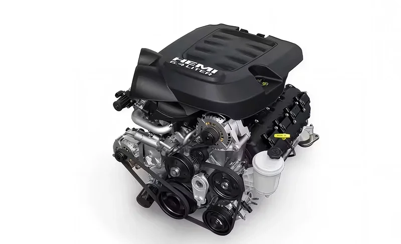 6.4L HEMI V8 engine with a black moulded engine cover on a white background