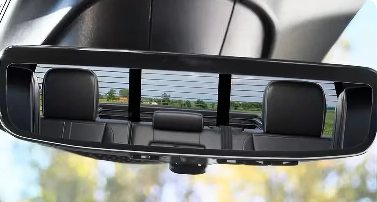 RAM rearview mirror in standard mode reflecting the rear seats and cabin of the truck