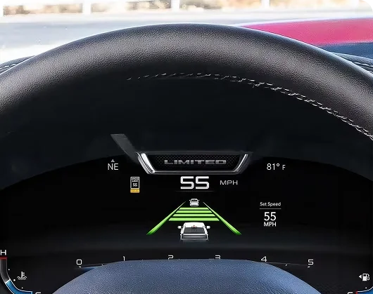 RAM digital cluster showing green lane guide lines and a recognised 55 mph set-speed sign