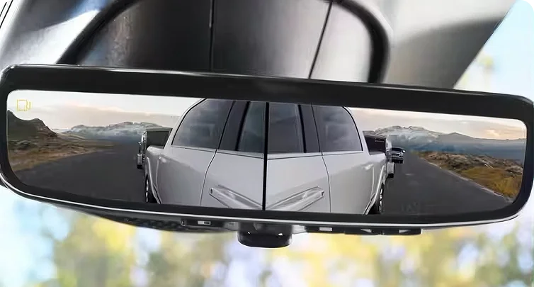 RAM digital rearview mirror showing the exterior mirror camera feeds beside a white car behind the truck