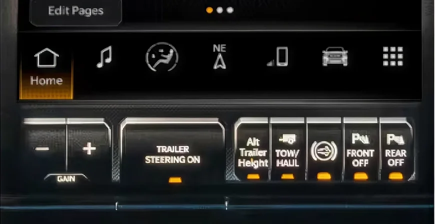 RAM dashboard controls with the trailer steering knob and the Trailer Steering On button lit amber