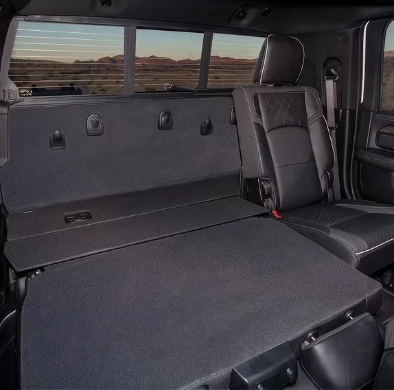 RAM 3500 rear bench folded fully flat creating a long carpeted load floor