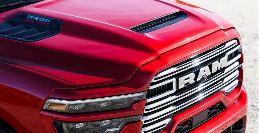 Close-up of the Mopar Sport Performance Hood scoop and 3500 Heavy Duty badge on a dark RAM 3500