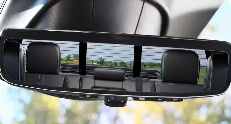 RAM rearview mirror in standard mode reflecting the rear seats and cabin of the truck