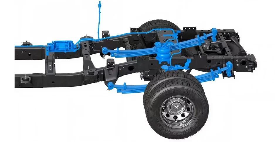 Cutaway RAM 3500 chassis showing the steel frame, rear axle and blue auto-level air suspension springs