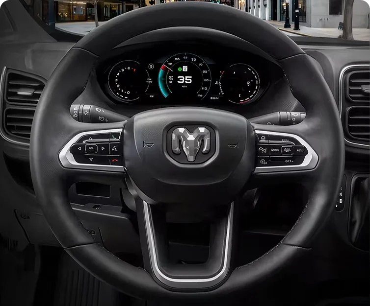 RAM steering wheel and instrument cluster showing a green speed limit indicator