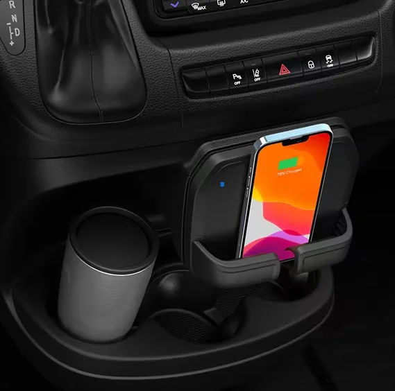 Smartphone charging wirelessly on the charging shelf in a RAM ProMaster console