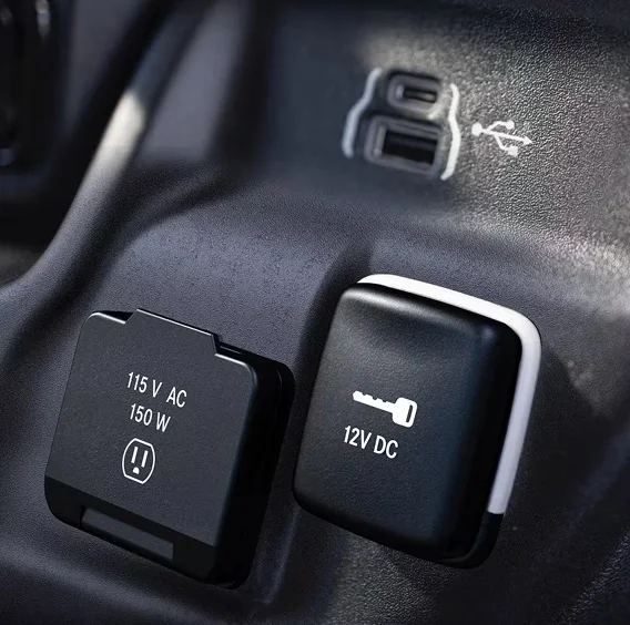 Close-up of the USB and 12-volt power outlets on a RAM ProMaster dashboard