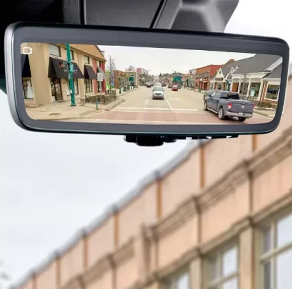 Digital rearview mirror in a RAM ProMaster showing a real-time video stream of the road behind