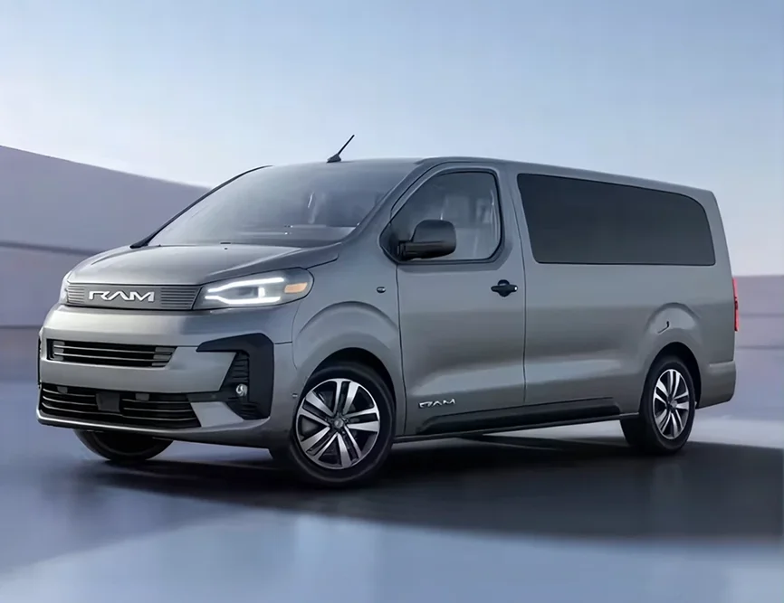 Gray RAM ProMaster City passenger van with alloy wheels shown front three-quarter on a light studio floor