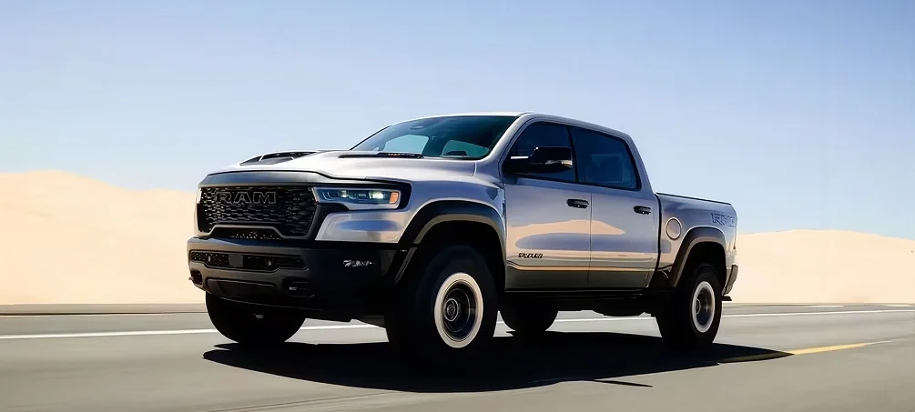 RAM 1500 raised on a service lift while a technician inspects the undercarriage