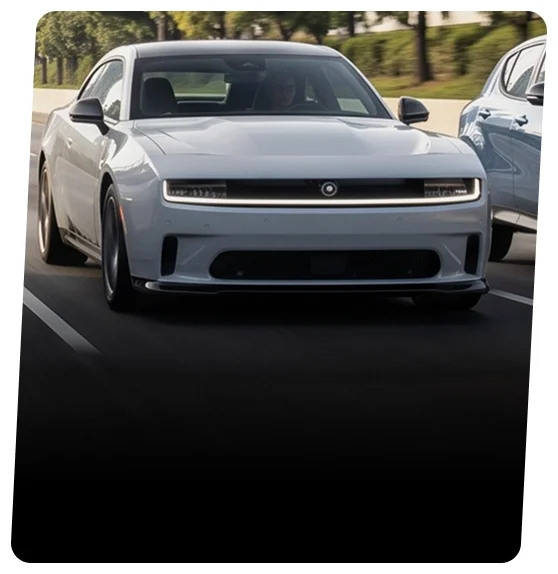 Silver all-electric Dodge Charger Daytona on an open road